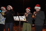 Fire unge musikere med julesanger.